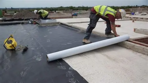 Waterproofing Services contractors installing a commercial waterproofing membrane